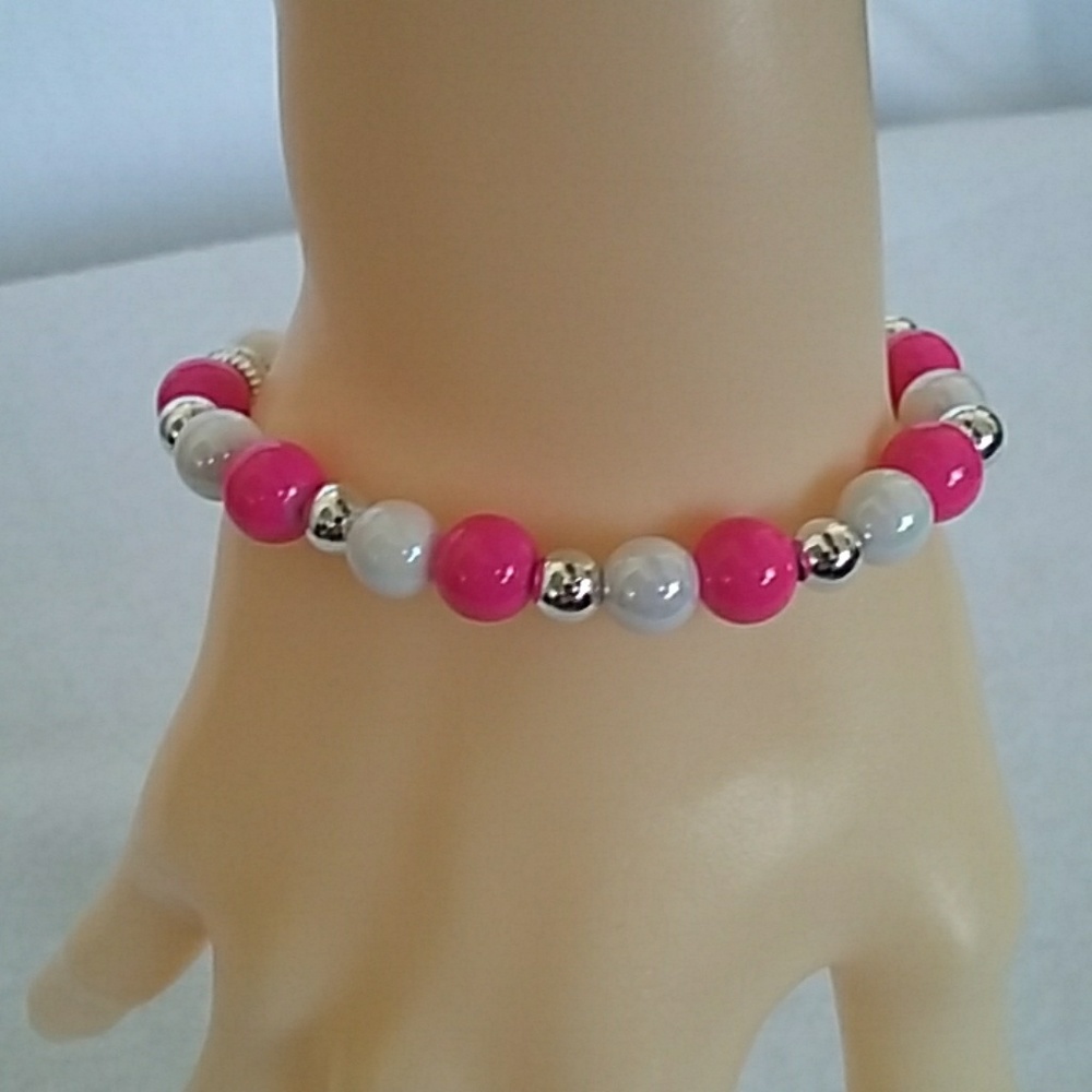 Pink, white, and silver beaded stretch bracelet